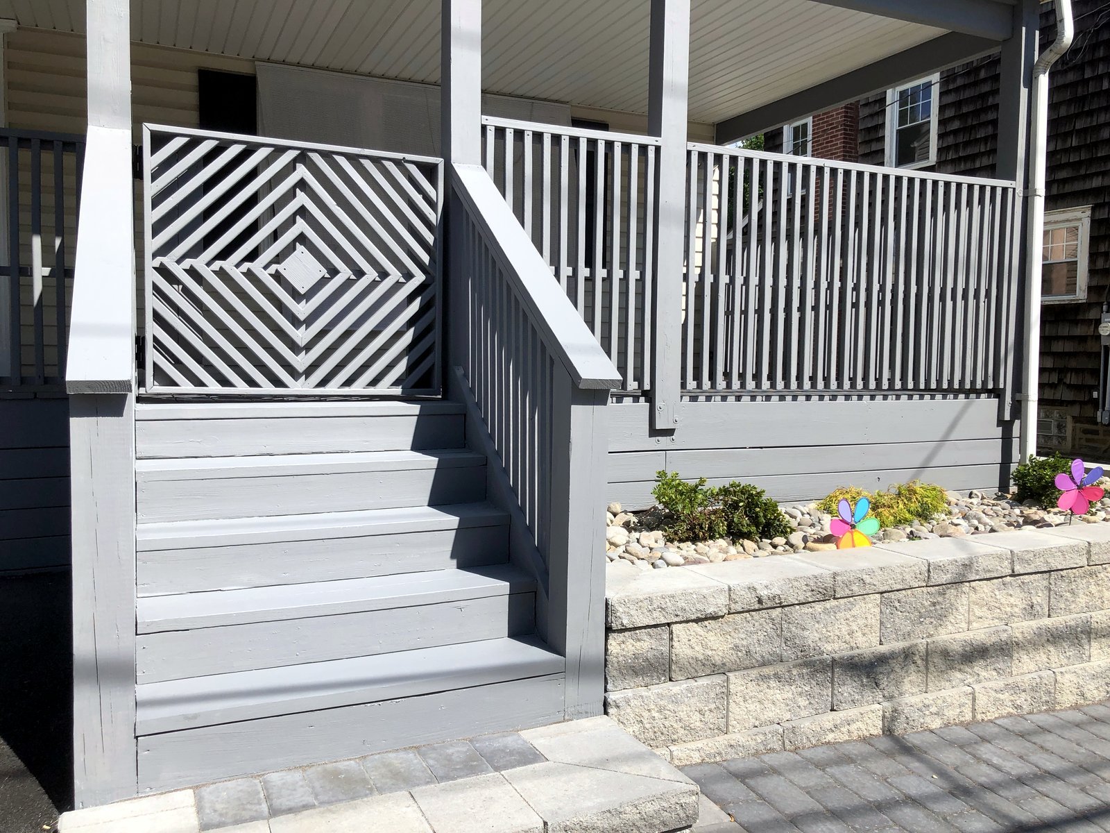 Covered porch stairs and decorative railing panel