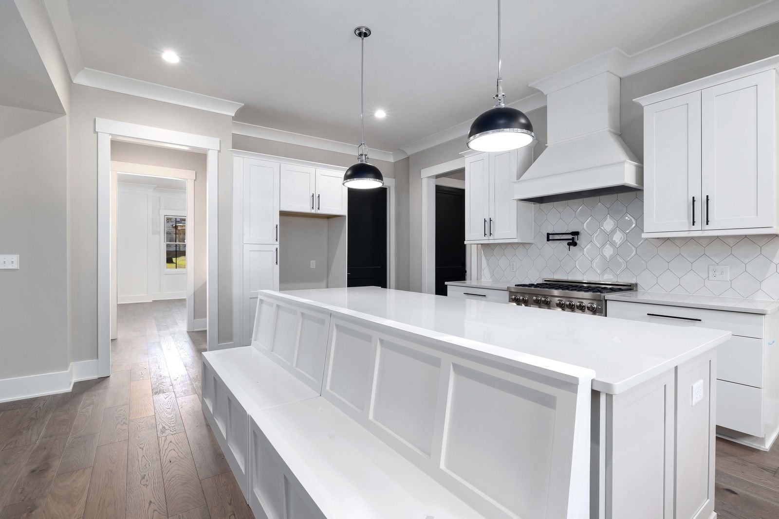 Renovated kitchen with white cabinetry and modern finishes, a completed CP Contractors & Builders project